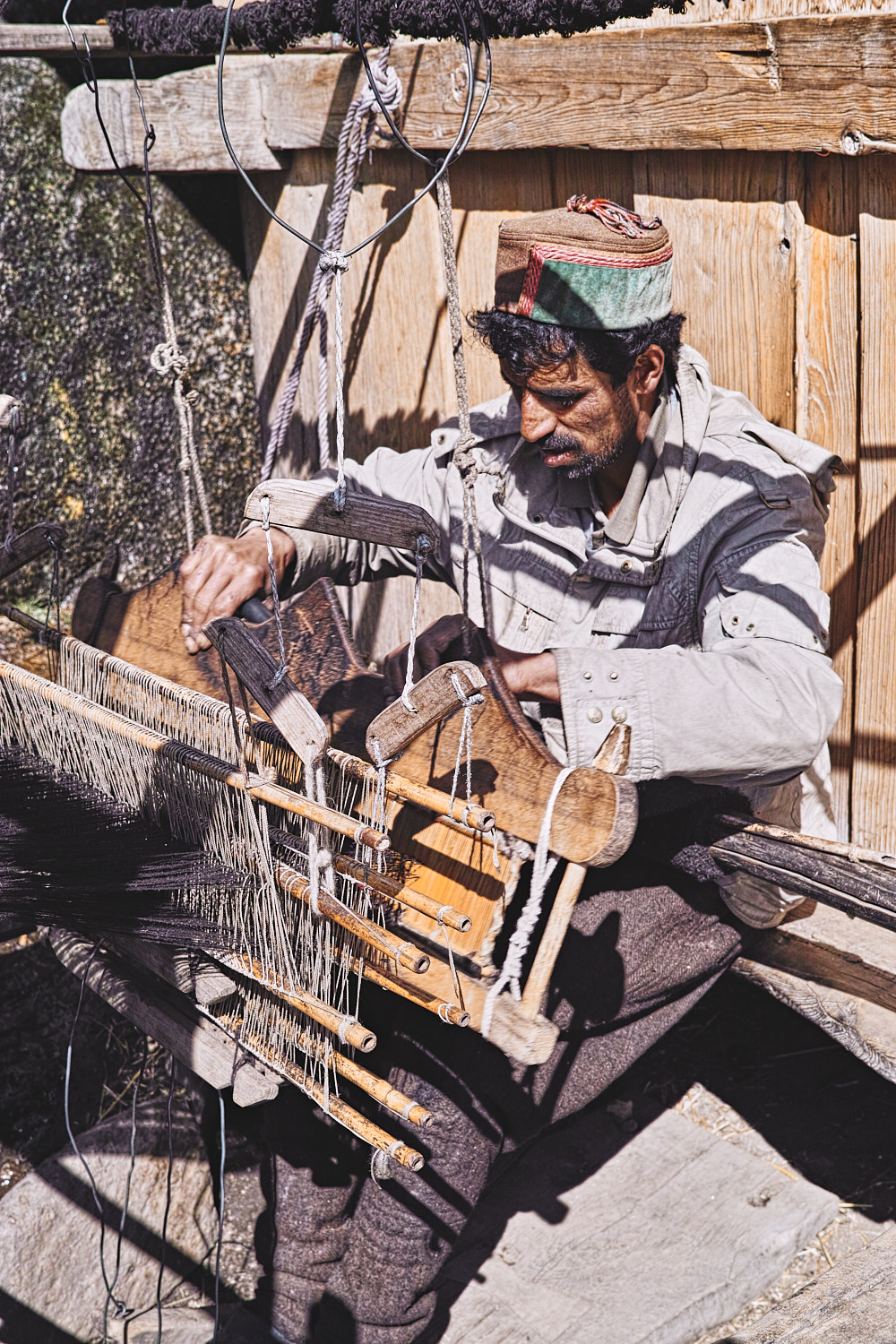 Weaver on a handloom at Osla village on Har Ki Dun trek trail